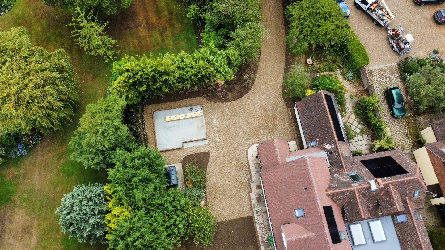 An aerial view of a parking lot in a residential area.