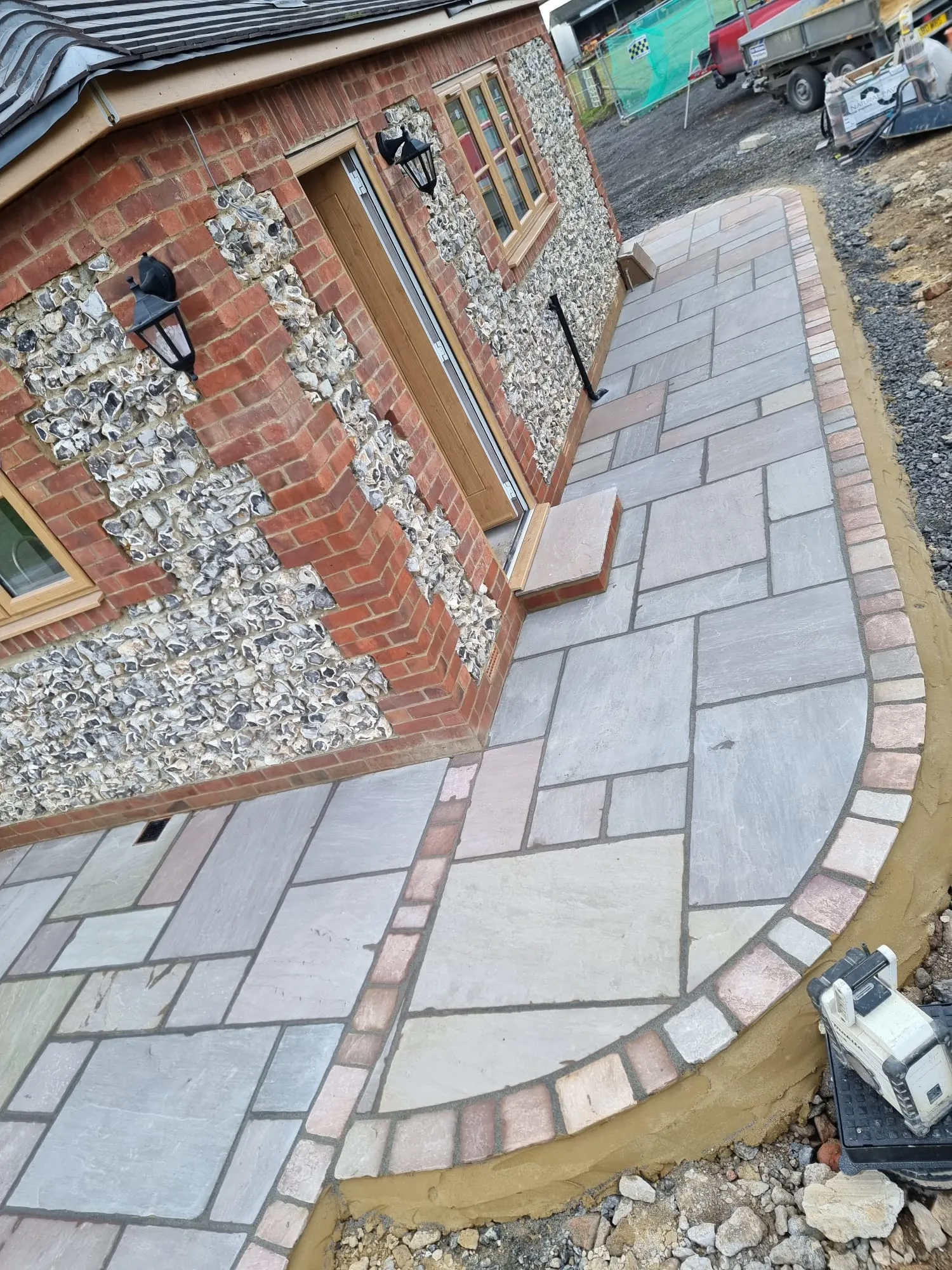 a house with a brick walkway next to it