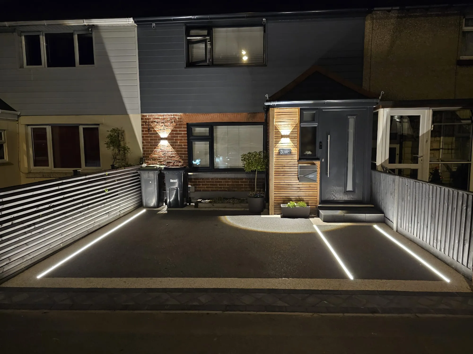 a house at night with the lights on